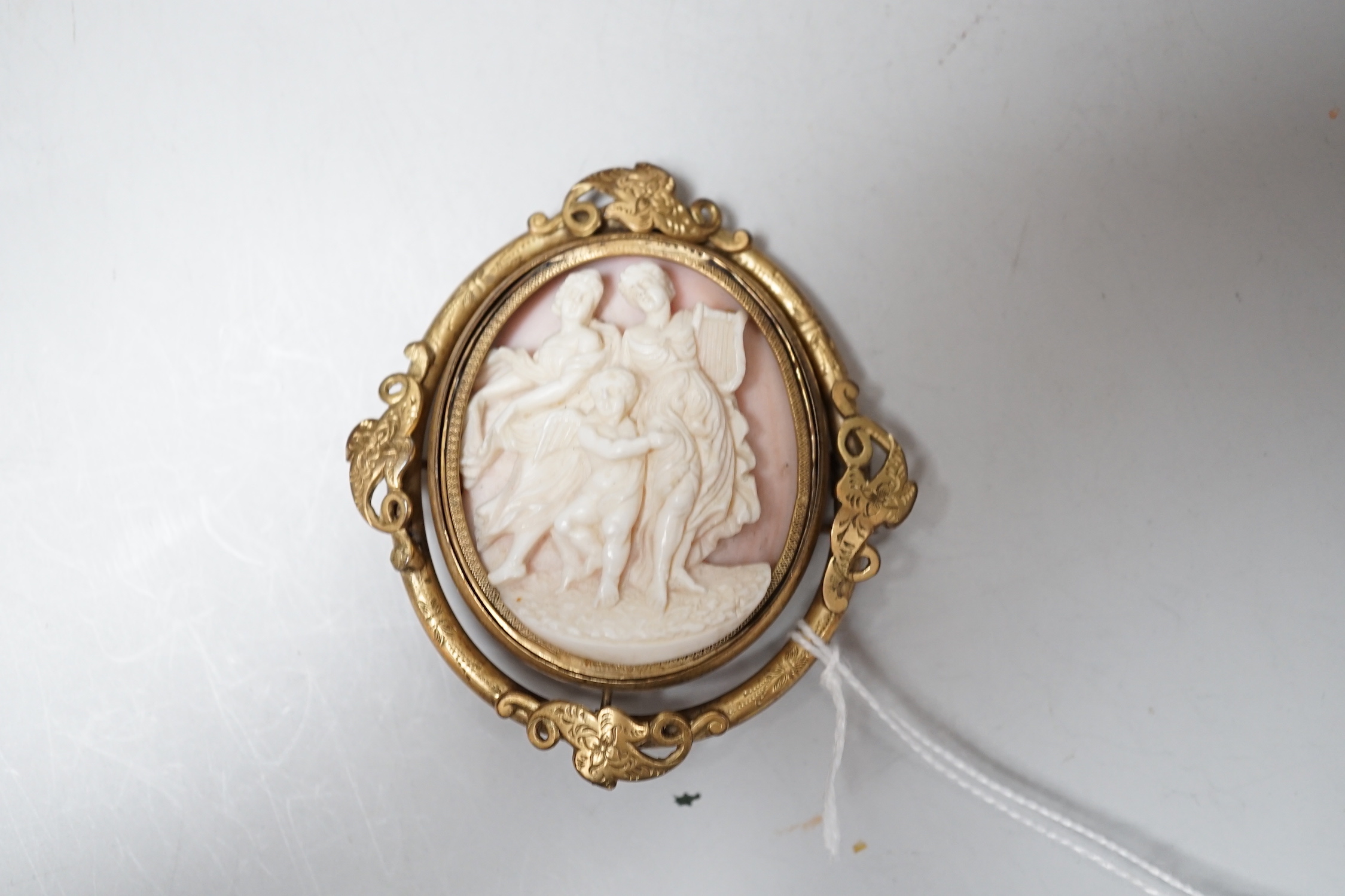 A crocodile jewellery box and a cameo brooch.